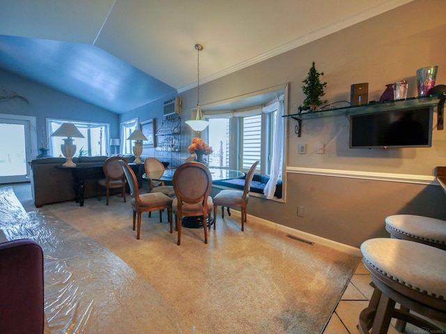 dining room featuring tile patterned flooring, lofted ceiling, ornamental molding, and a wall unit AC