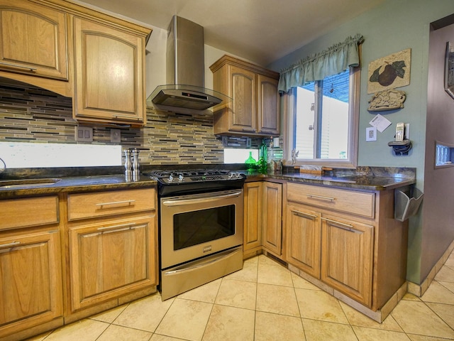 kitchen with backsplash, wall chimney exhaust hood, stainless steel electric range oven, and sink