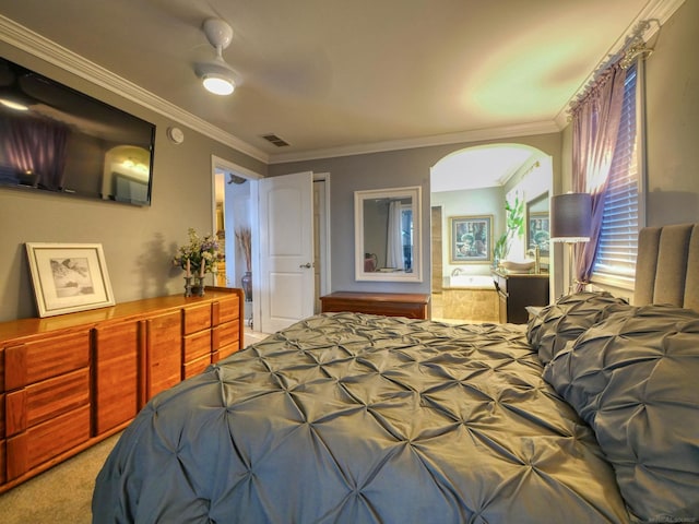 carpeted bedroom with ceiling fan and ornamental molding