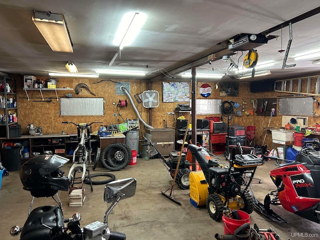 garage featuring a workshop area and a garage door opener