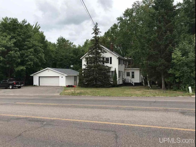 view of front facade with a front lawn and a garage