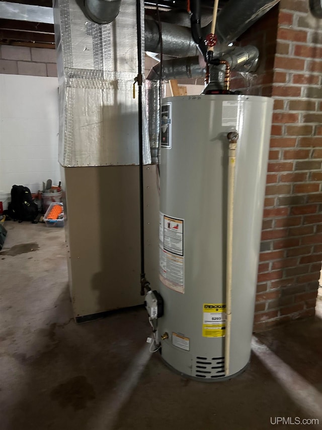 utility room featuring water heater