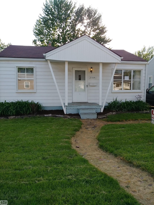 bungalow with a front lawn