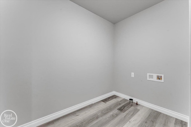 washroom featuring washer hookup and light wood-type flooring