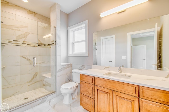 bathroom featuring tile floors, a shower with shower door, vanity, and toilet