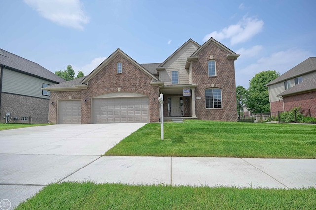 front facade featuring a front lawn and a garage