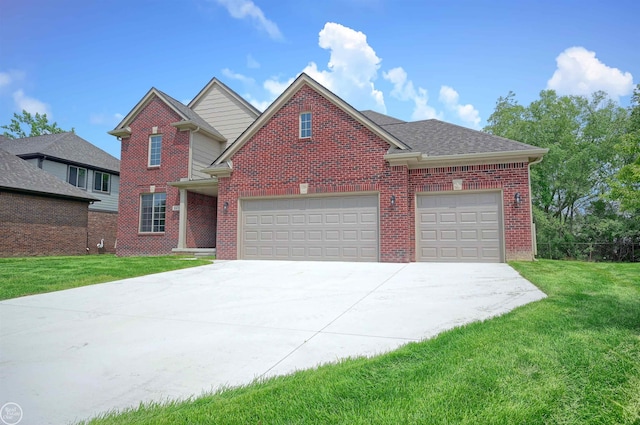 view of property featuring a front lawn and a garage