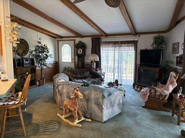 carpeted living room featuring beam ceiling