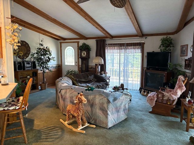 carpeted living room with beam ceiling