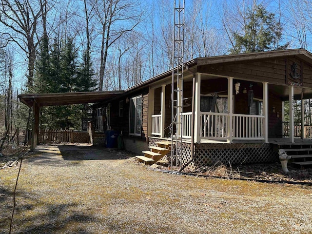 view of front facade with a carport and a porch