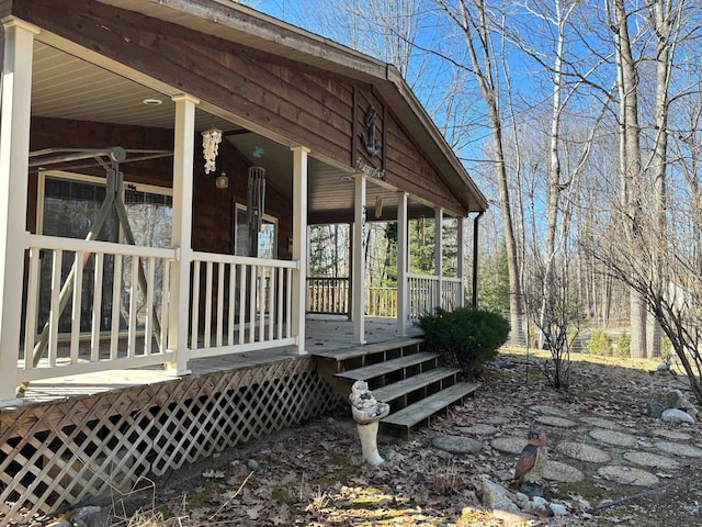 view of property exterior featuring covered porch