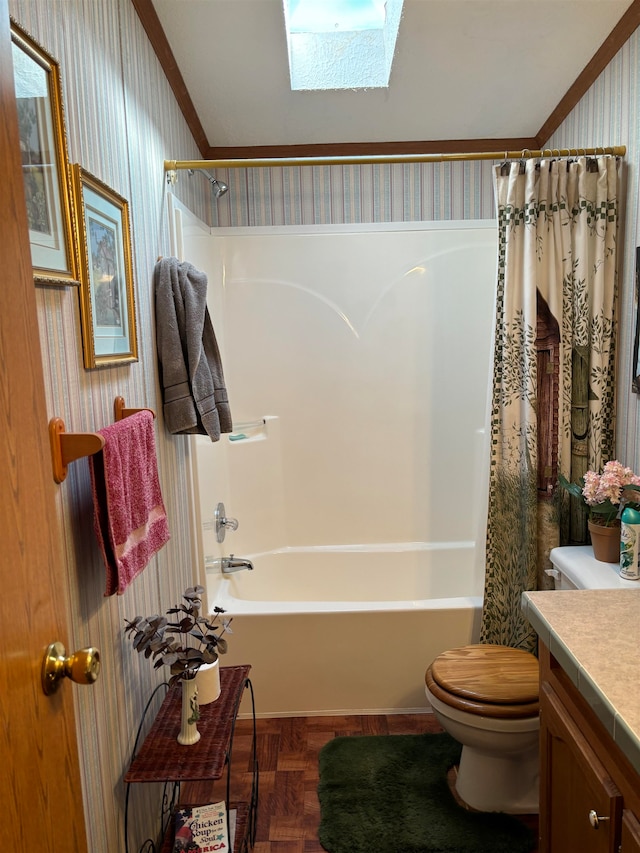 full bathroom with vanity, toilet, a skylight, and shower / bath combo with shower curtain