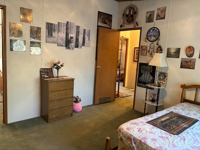 bedroom featuring dark colored carpet