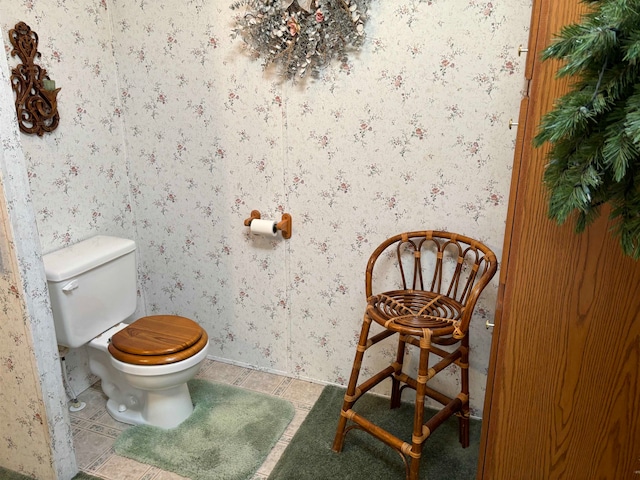 bathroom featuring tile patterned flooring and toilet