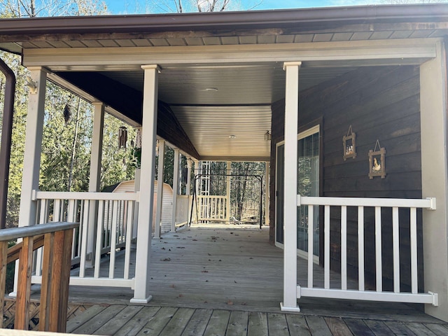 wooden deck with a shed