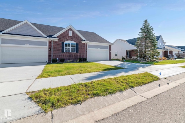 ranch-style house featuring a front yard and a garage