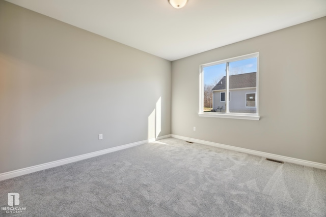 empty room featuring light colored carpet