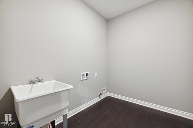 clothes washing area featuring sink, hardwood / wood-style floors, and hookup for a washing machine