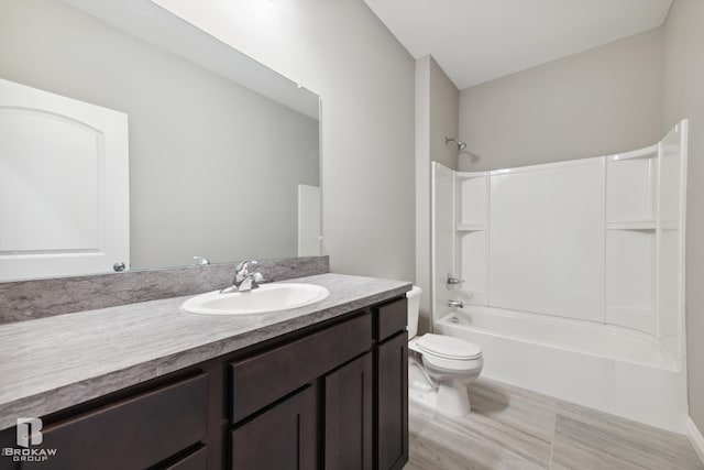 full bathroom with toilet, bathtub / shower combination, and vanity with extensive cabinet space