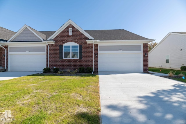 ranch-style home featuring a front lawn and a garage