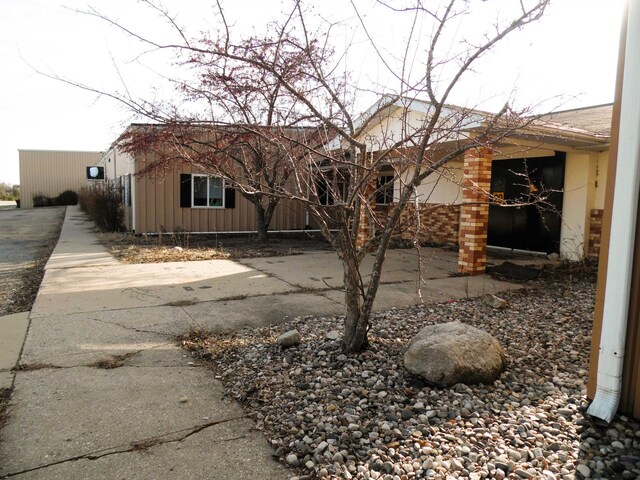 back of property with a garage