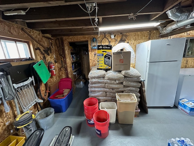 basement featuring white refrigerator