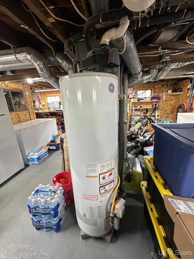 utility room with gas water heater