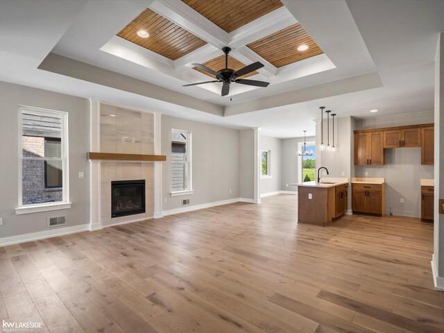 unfurnished room featuring beam ceiling, wooden ceiling, light hardwood / wood-style floors, and ceiling fan with notable chandelier