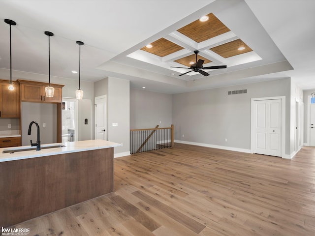 unfurnished living room with a wealth of natural light and light hardwood / wood-style flooring