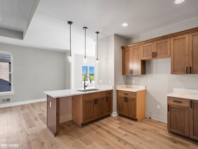 empty room featuring an inviting chandelier and light hardwood / wood-style flooring