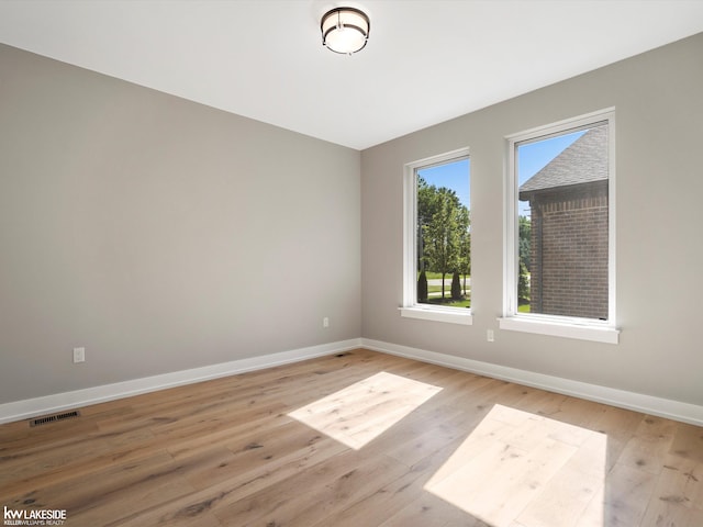 empty room with wood-type flooring