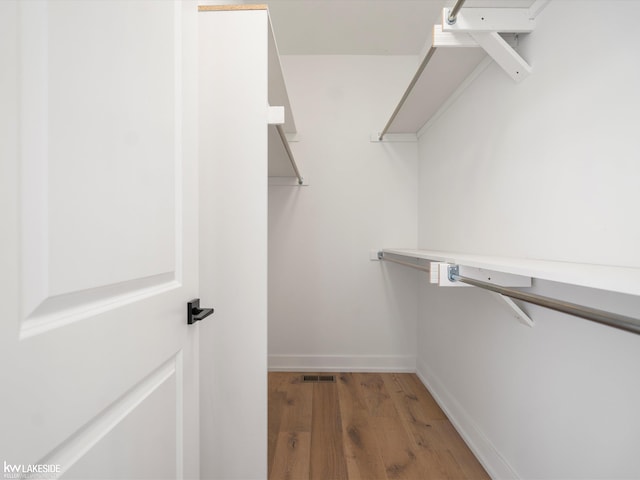 spacious closet with wood-type flooring