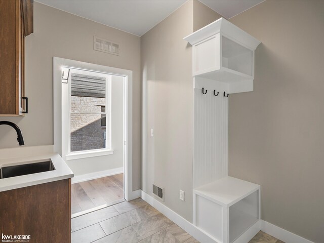 empty room featuring light hardwood / wood-style floors and ornamental molding