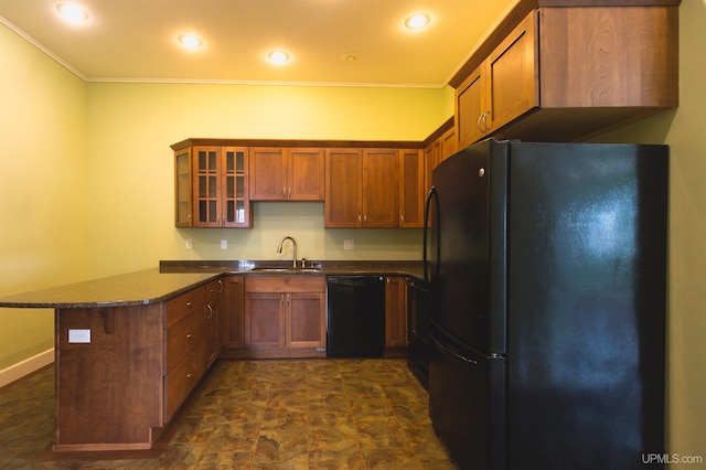 kitchen with kitchen peninsula, black appliances, crown molding, dark stone countertops, and sink