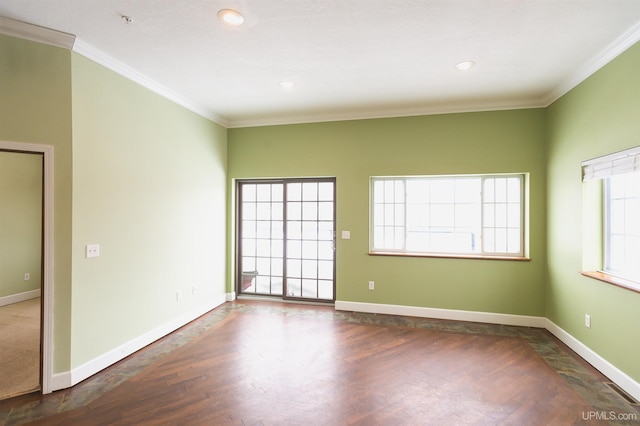 unfurnished room featuring dark hardwood / wood-style flooring and ornamental molding