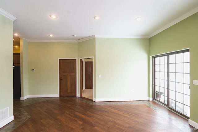 spare room with ornamental molding, dark hardwood / wood-style floors, and a wealth of natural light