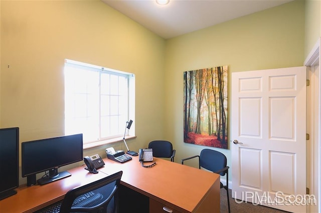 home office featuring dark colored carpet