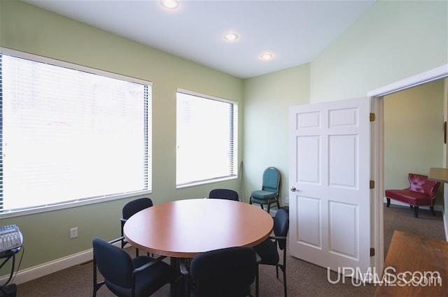 dining area with dark carpet