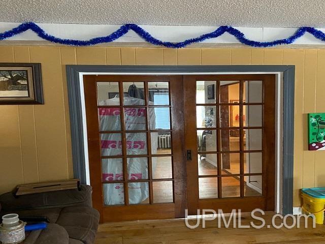 entryway with hardwood / wood-style floors