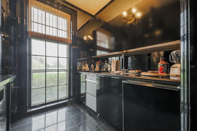 bar featuring dark tile floors