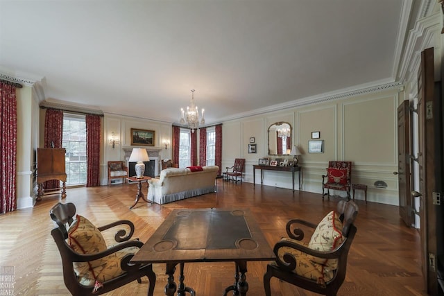 dining area featuring light parquet flooring, a notable chandelier, and ornamental molding