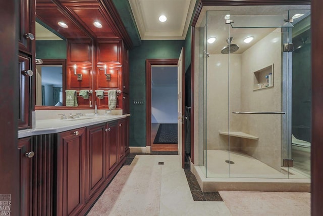 bathroom featuring tile floors, large vanity, and a shower with door