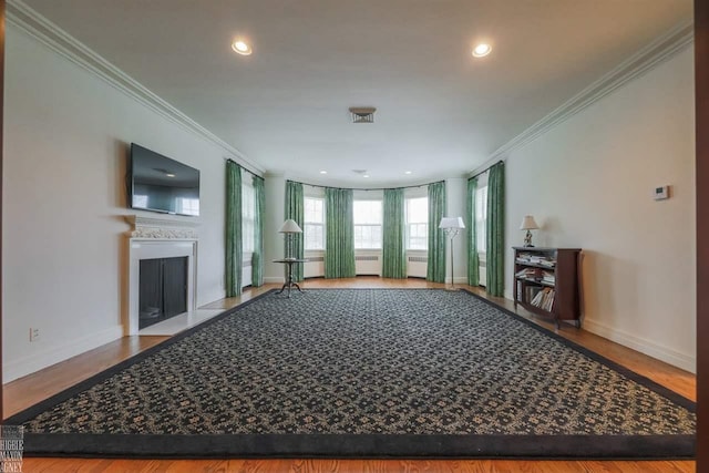 unfurnished living room with light hardwood / wood-style flooring and ornamental molding