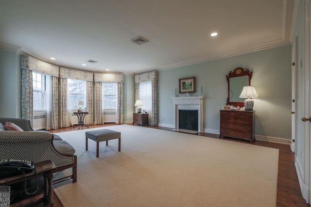 living room featuring crown molding and dark hardwood / wood-style flooring