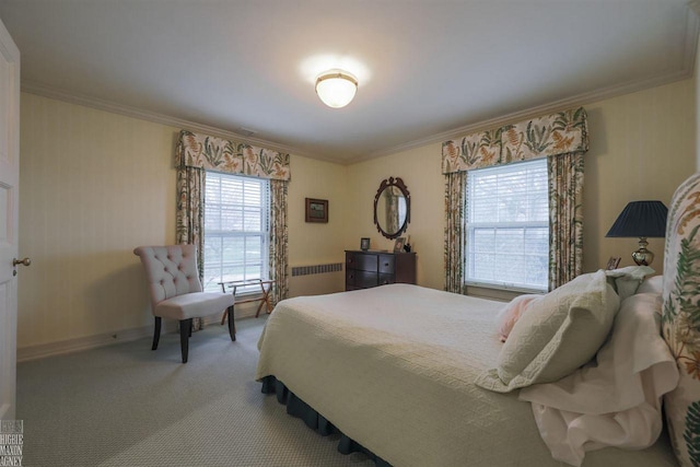 bedroom featuring radiator, ornamental molding, and light colored carpet