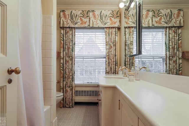 full bathroom with oversized vanity, toilet, a healthy amount of sunlight, and tile flooring