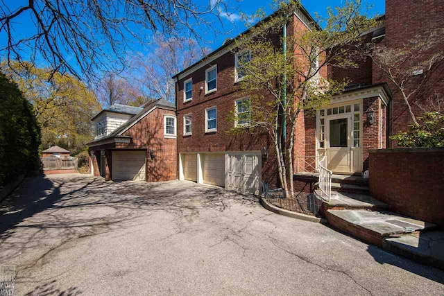 view of side of property with a garage