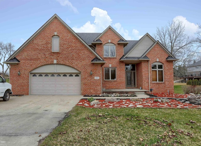 front of property featuring a front lawn and a garage