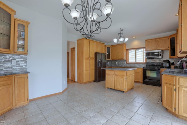 kitchen with tasteful backsplash, a kitchen island, light tile floors, a chandelier, and black appliances