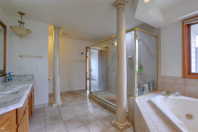 bathroom featuring separate shower and tub, plenty of natural light, tile floors, and ornate columns